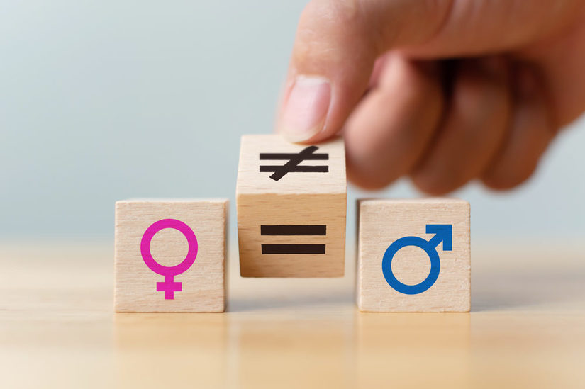 Würfel mit weiblichem und männlichem Symbol und Gleichzeichen